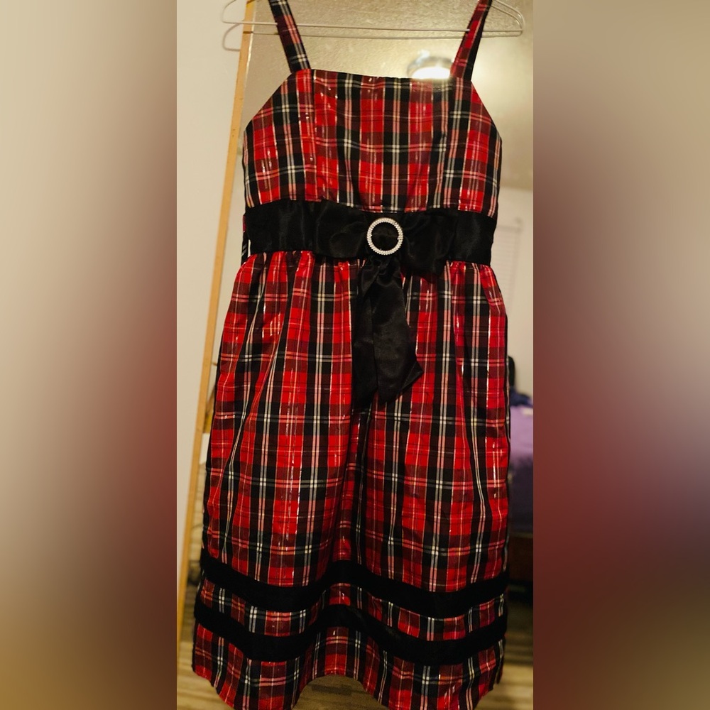 A red plaid "Disorderly Kids" brand dress size16 with a bow in front.  Like new!
